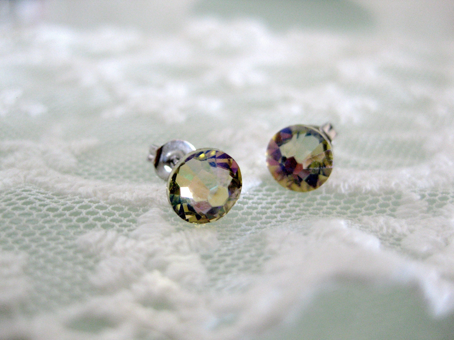 Luminous green swarovski crystal stud earrings for everyday. Luminous champagne yellow stud earrings for everyday or special occasions