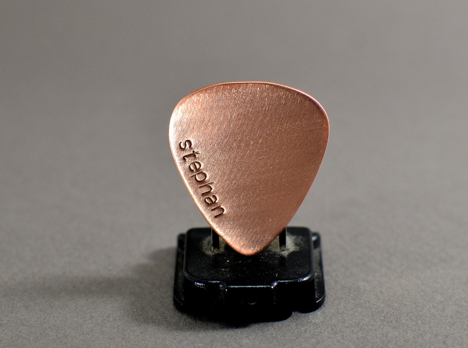 Copper guitar pick with personalized name