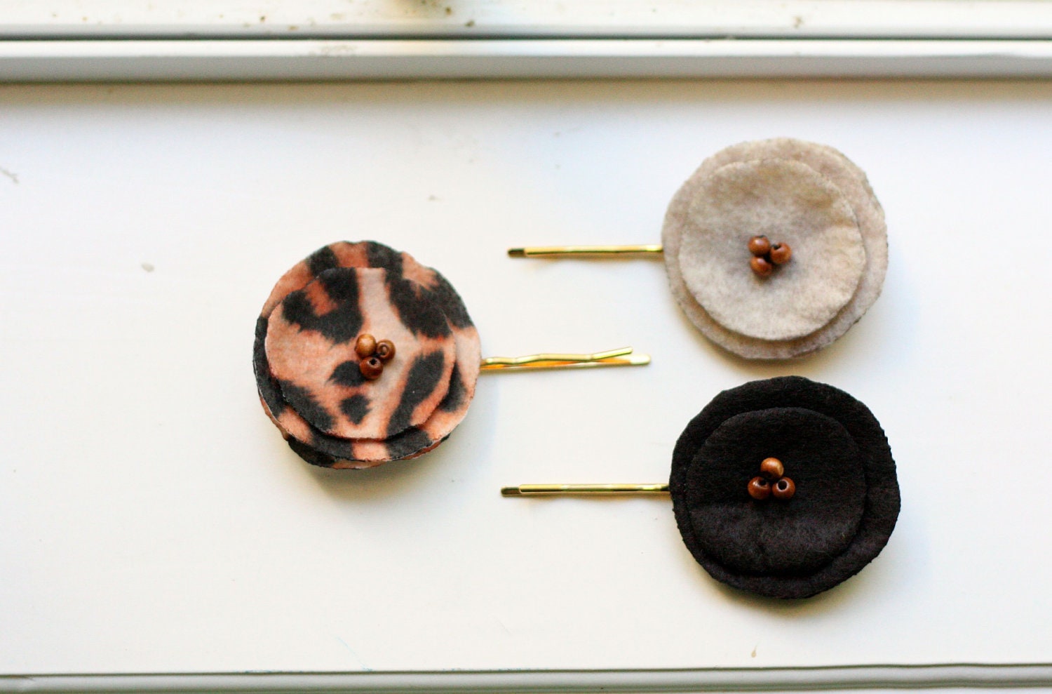 a city girl's leopard print dark brown marble felt poppy bobby pins.