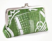 Organic green hand loomed hemp clutch purse with art deco styled screenprint design and an 8 inch silver purse frame.