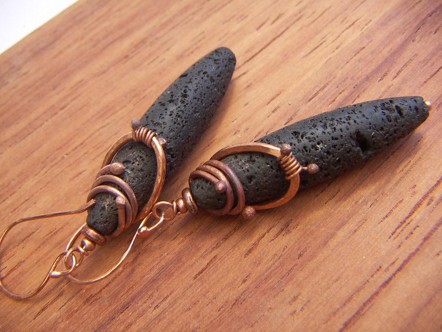 Long Oval Lava Earrings With a Copper Wrap