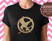 The Hunger Games Mockingjay Symbol Katniss Peeta Effie Haymitch Girl on Fire District 12 Glitter Short Sleeve Tee Shirt