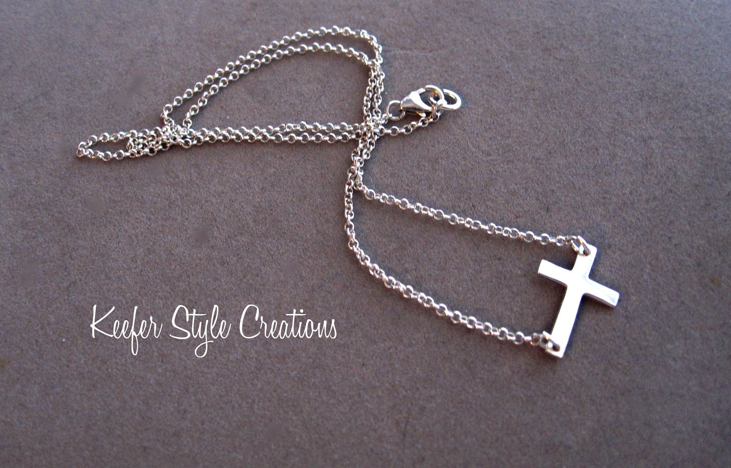 Sterling silver sideways cross necklace