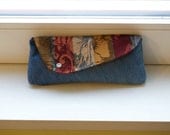 Balinese batik and handwoven songket textile and recycled denim clutch with snap closure