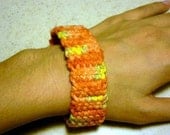 Poinsettia-coloured bracelet, 8 inches long, crocheted