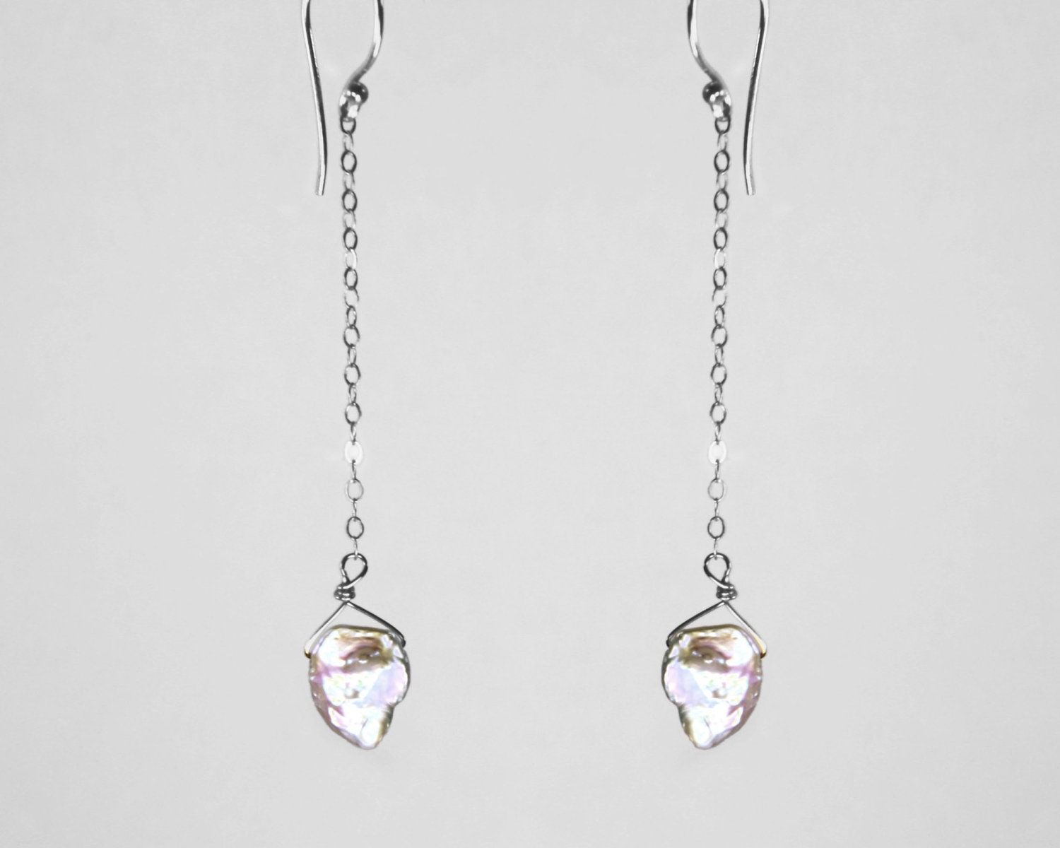 Dangling Karats. Keishi cornflake pearl earrings. Delicate long sterling silver and white earrings like a leaf in the wind..