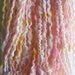 Handspun Art Yarn (Pink Lemonade) Thread Ply Merino, Faux Cashmere and Coltswold Locks.