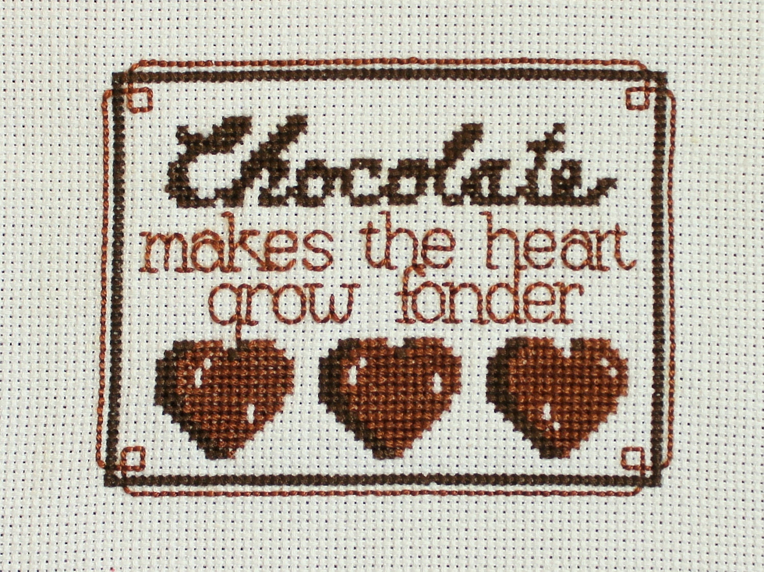 Completed cross stitch - Chocolate makes the heart grow fonder