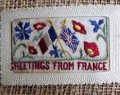 Greetings from France via a Needlepoint Vintage Postcard