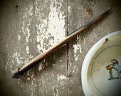 hand-turned supported spindle, slim black and white ebony