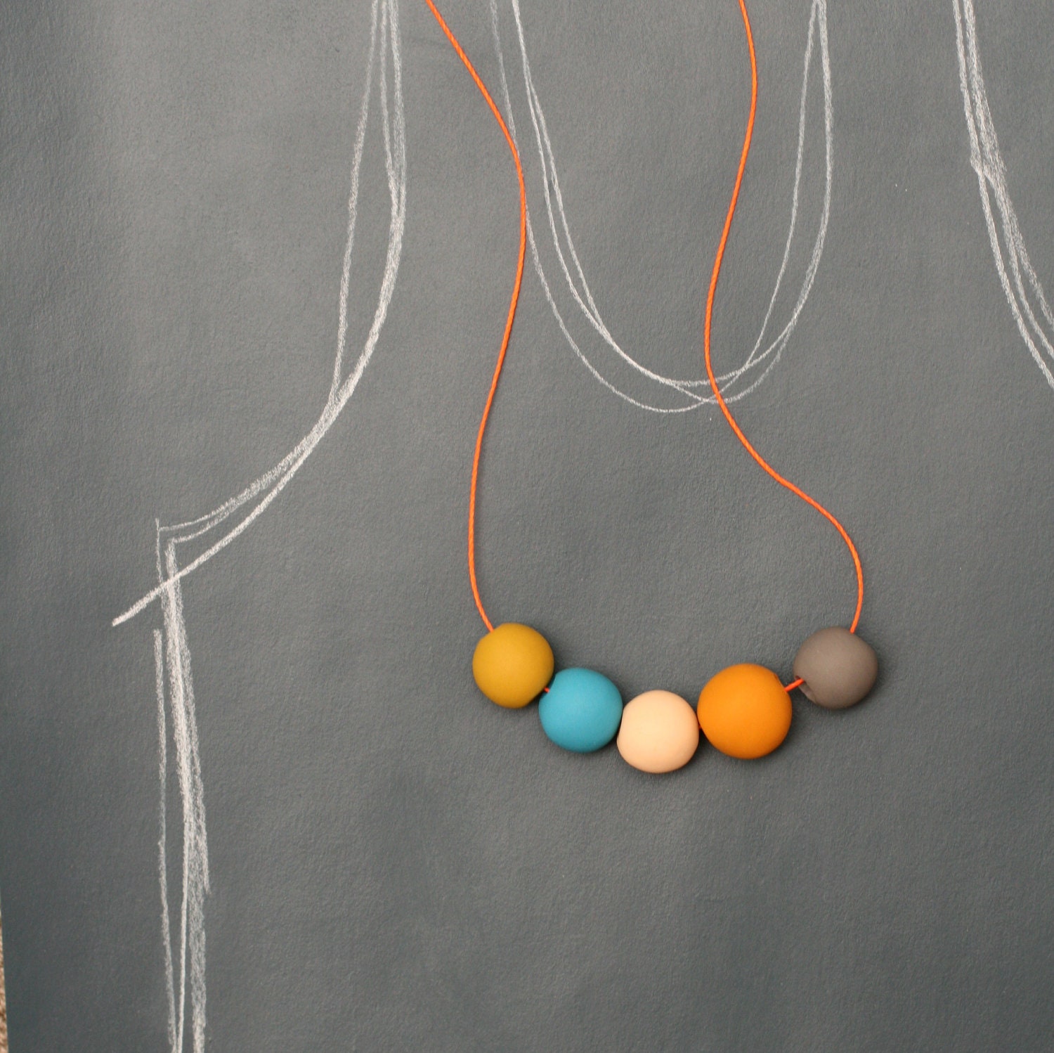 not quite round handmade beads make a necklace