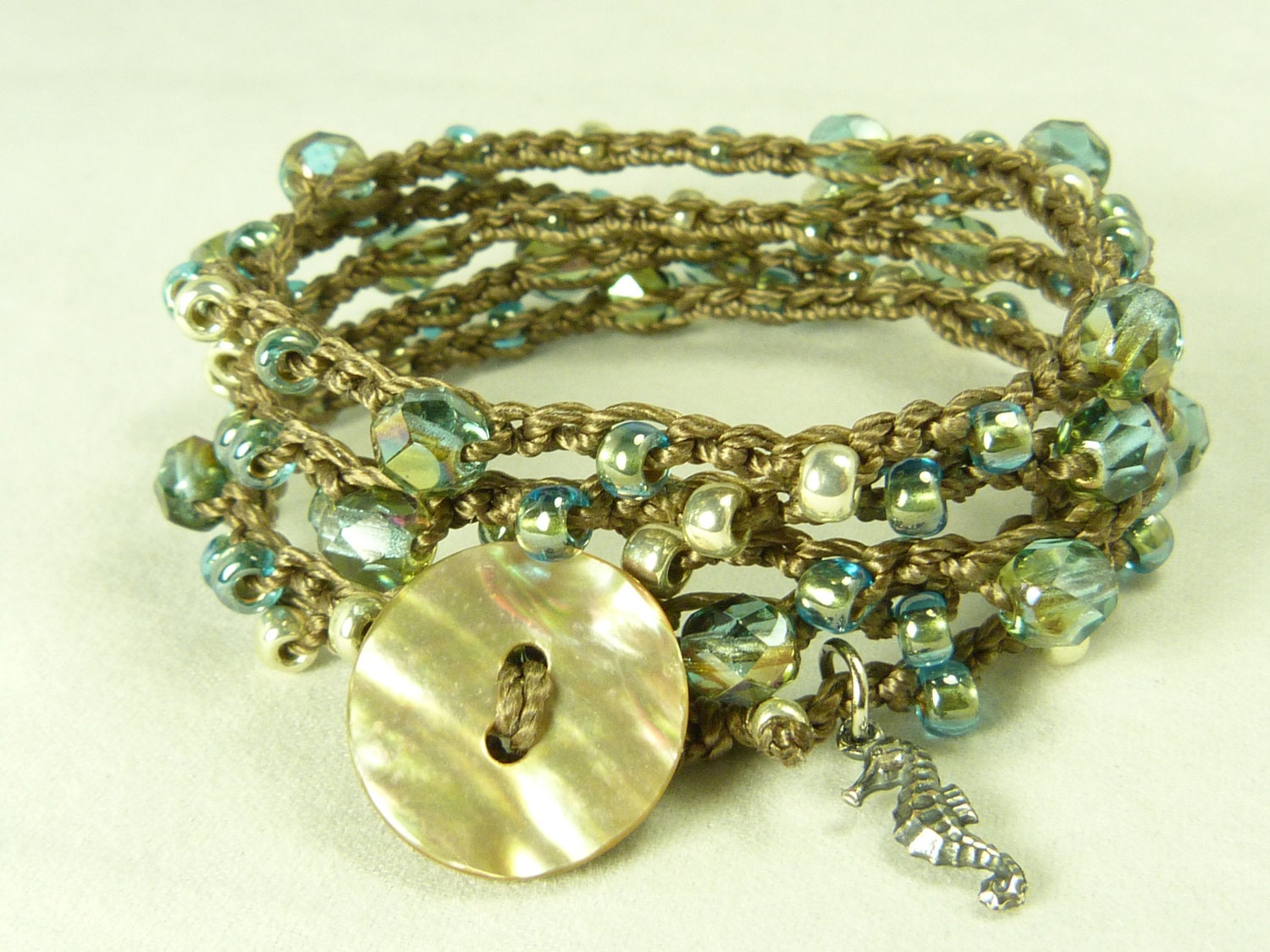 Beautiful bead crochet bracelet, aqua, five wrap with shell button closure, seahorse charm, boho wear,  bracelet or necklace.