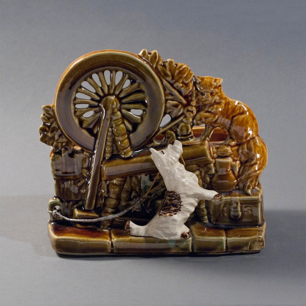 Items similar to Vintage McCoy Spinning Wheel Pottery Planter on Etsy