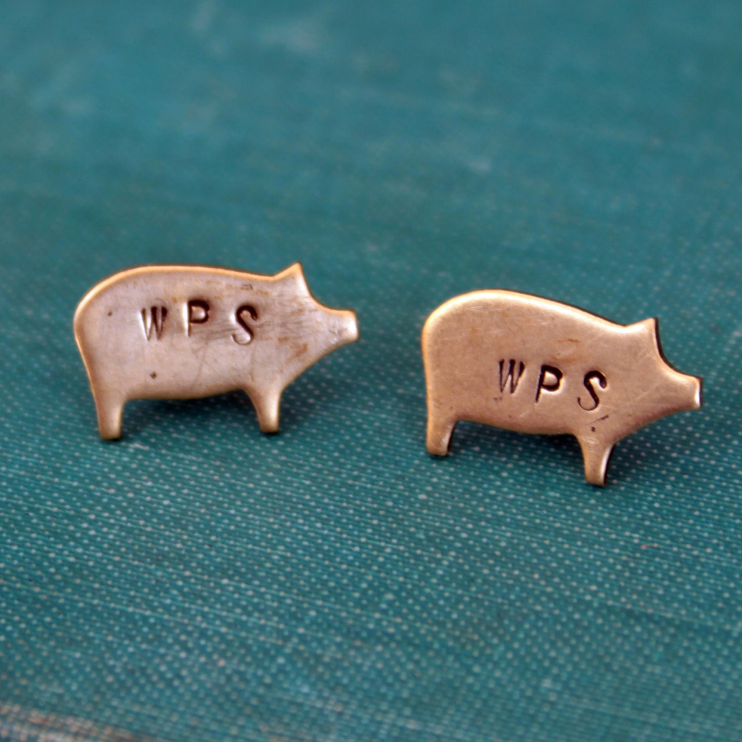 Brass Razorback stud earrings. WPS