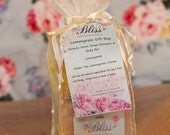 Lemongrass Gift Bag includes a shampoo & body bar, bar of soap, and a hard lotion bar