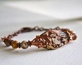 Bracelet made with wood agates and copper beads