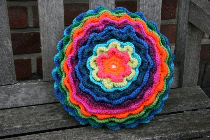 Blooming flower pillow in rainbow colors (orange - pink - green - blue - purple)