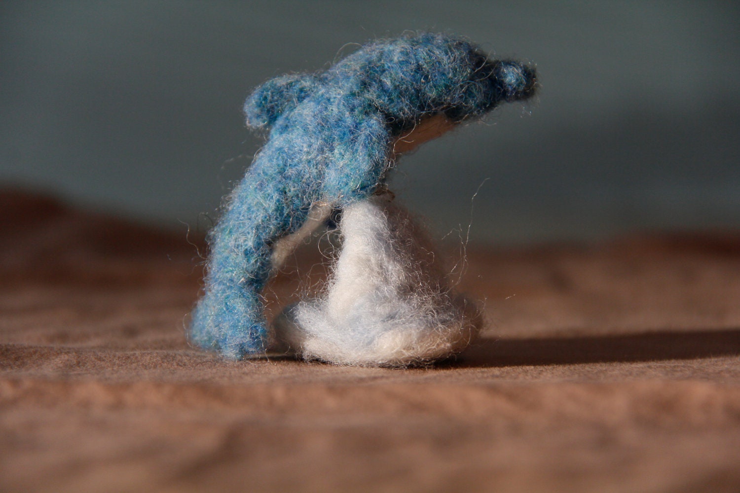 Dolphin needle felted on wave