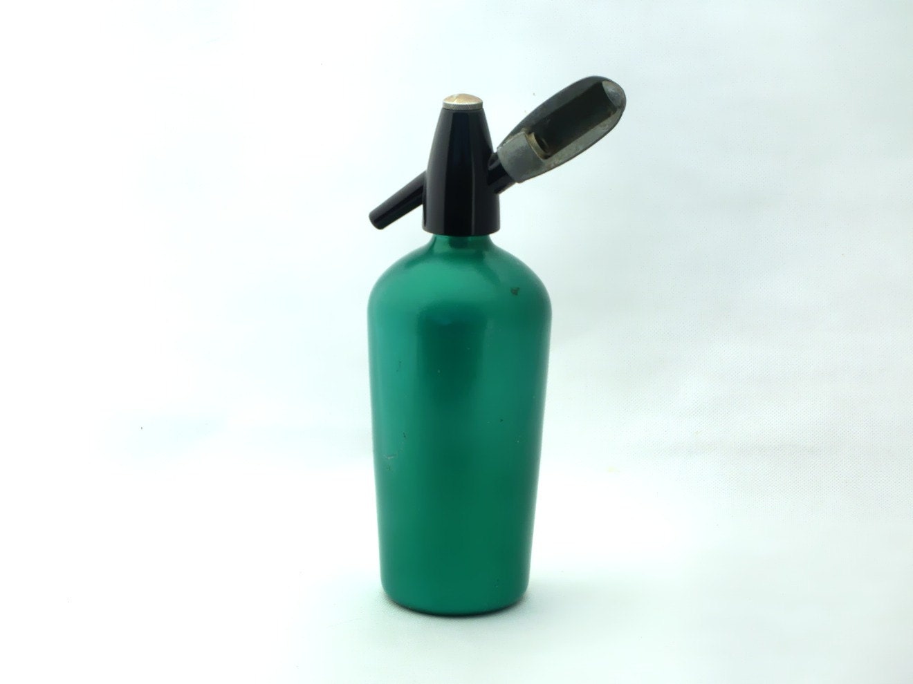 Vintage green aluminum seltzer bottle from 70s