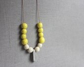 Handmade ceramic beads - strand necklace - yellow, cream and gray - beadwork on thin leather cord