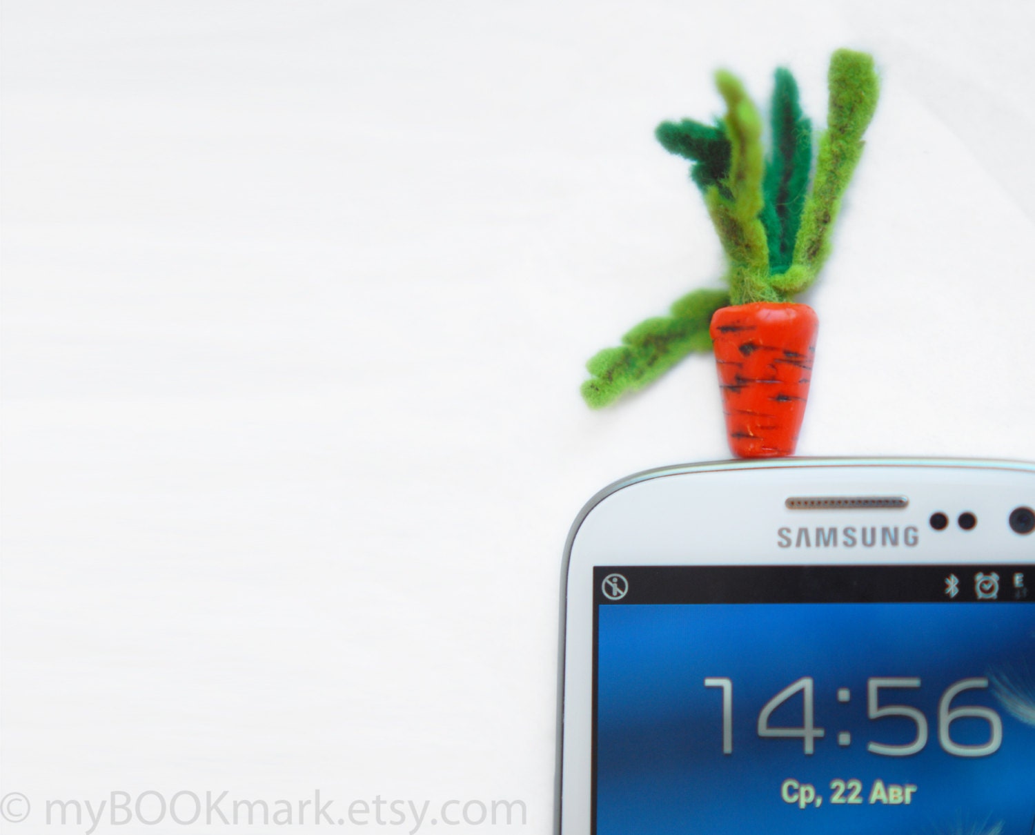 Cell phone accessory. Carrot plug for earphone jack. Miniature orange harvest. Fits iPhone 4 4s ,iPad ,Samsung galaxy s2 s3, 3.5mm output