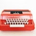 Vintage red typewriter by Byron Jardine Limited