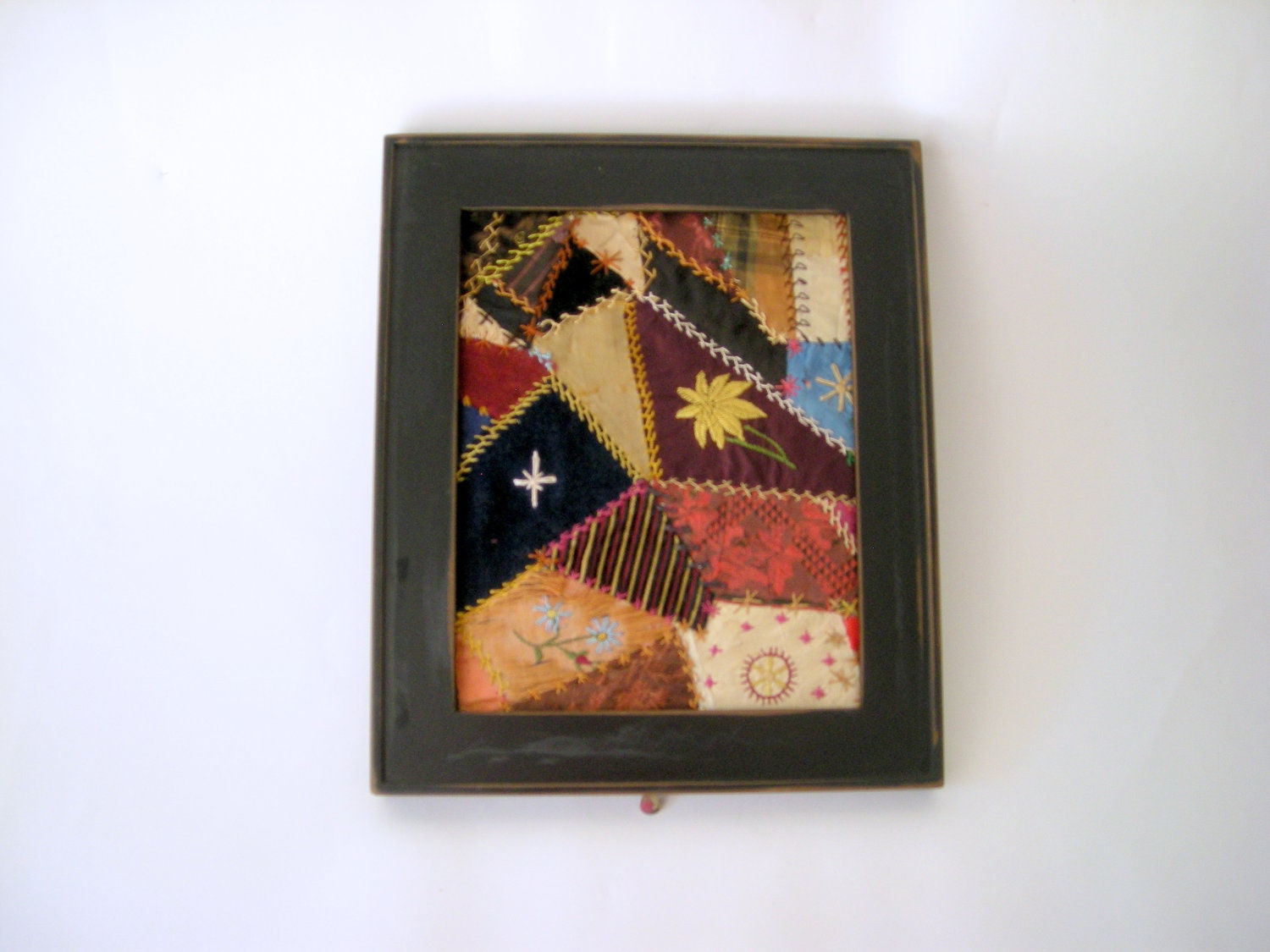 Crazy quilt block in frame