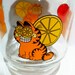Vintage Garfield glass carafe juice pitcher with lid.