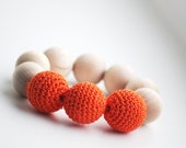 Nursing and teething toy for mamies and babies  Orange  color - stellocka
