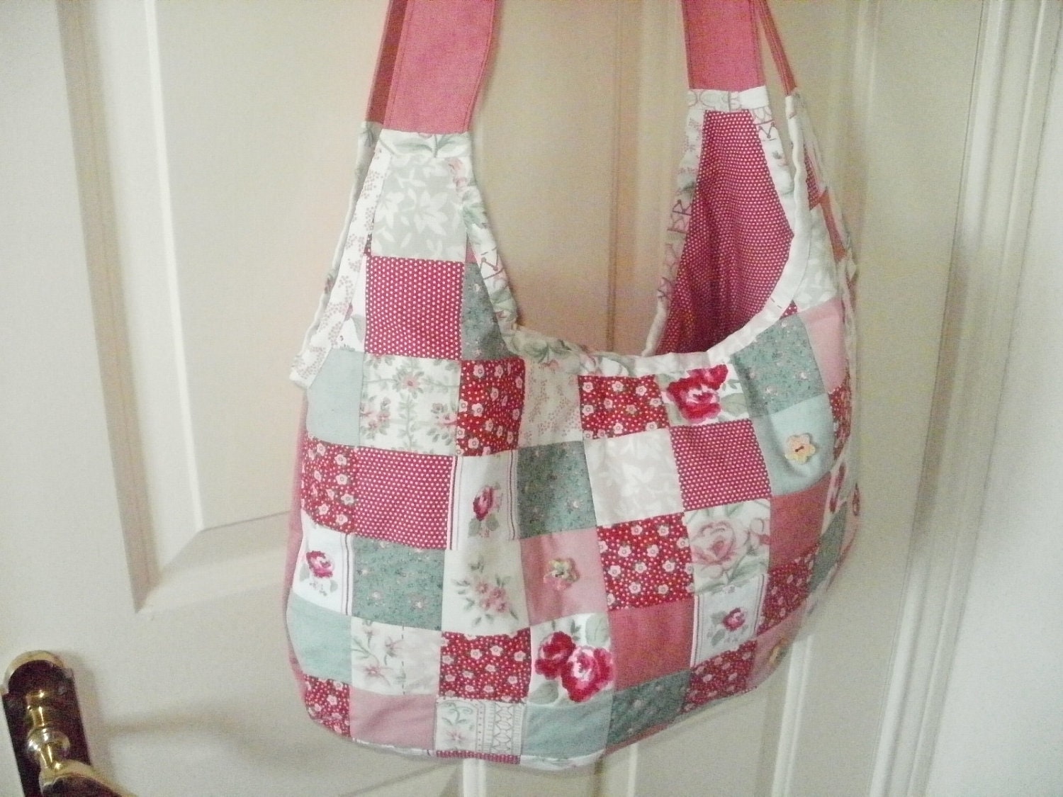 SALE 25% OFF Red slouchy patchwork long-strapped hobo bag with button detail.