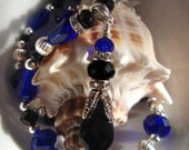 Black Tie Collection: Faceted black jet and cobat blue beaded necklace with swarovski crystal elements and silver bead accents