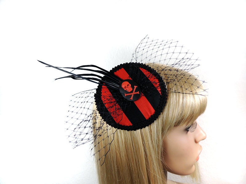 Goth pirate fascinator with black and red stripes and skull cameo