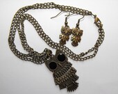 Articulated owl pendant necklace and earrings set in antique bronze