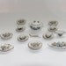 Dollhouse 18 piece dining set with a china cherry tree in blossom pattern, blue, white and gold colour.