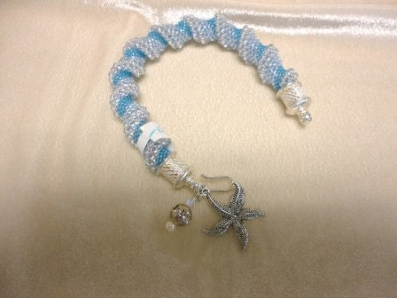beadwork bracelet. silver charm bracelet .spiral beaded bracelet. seed bead bracelet. seed bead jewelry. beadwork. fine jewelry