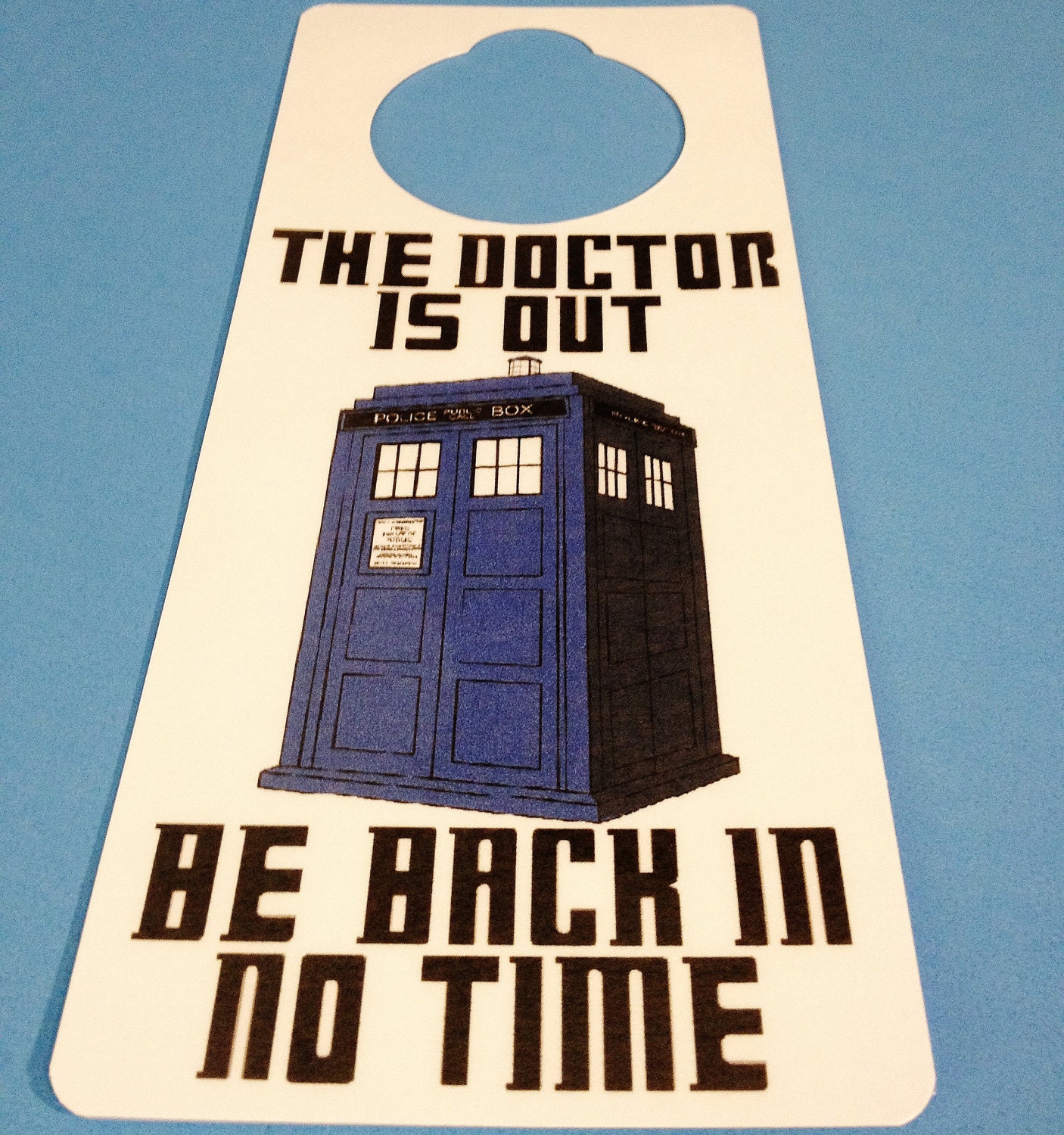 Doctor Who TARDIS blue door sign with dry erase board on the back.