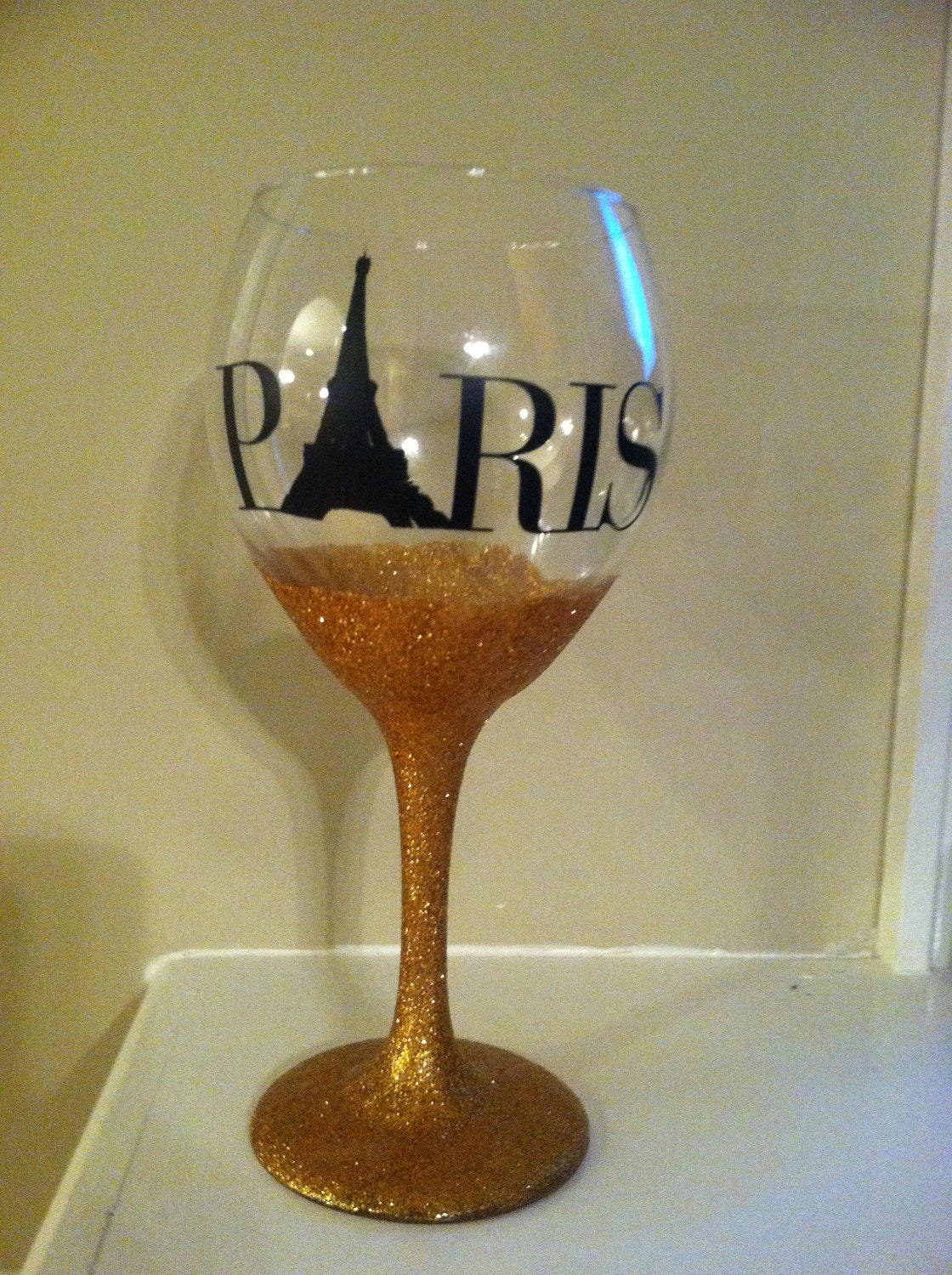 Wine glass with gold glitter base with Paris vinyl detail