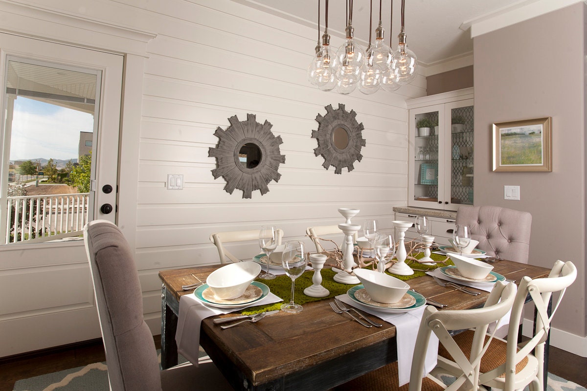 Custom Industrial Chandelier with Modern Glass Pendants in polished nickel sockets hung from rayon cord attached to premium base
