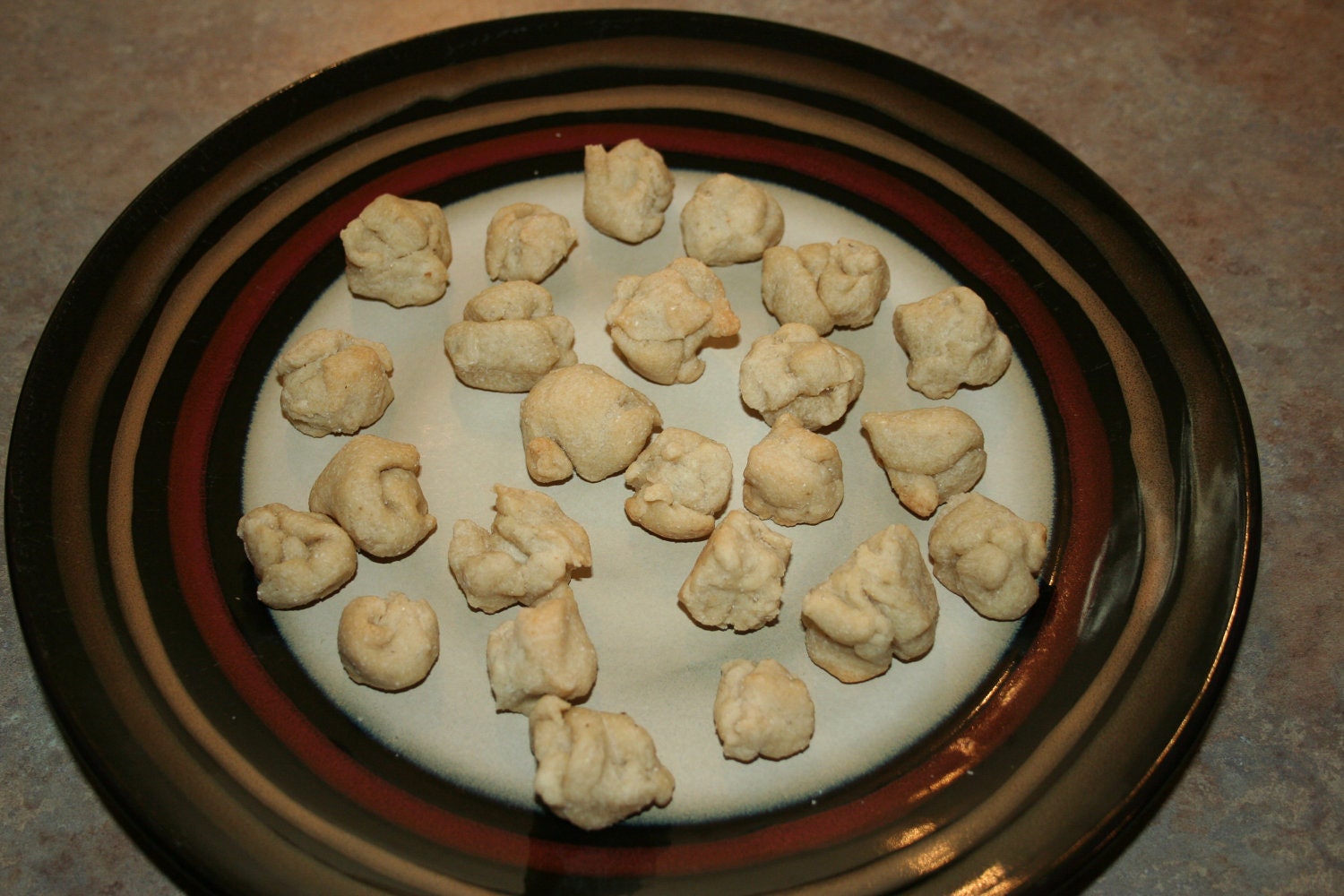 Twenty Four Small peanut butter treats for dogs.