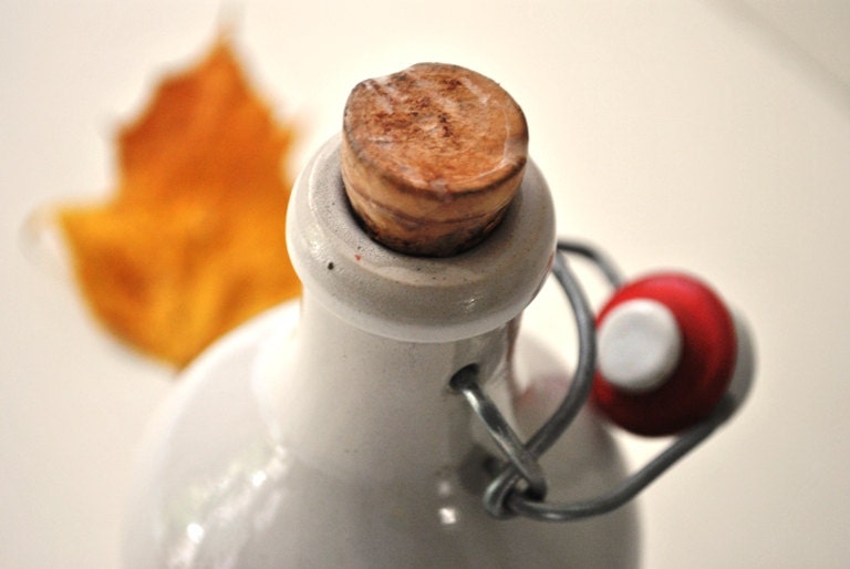 Vintage French Stoneware Covinor Red Wine Vinegar Bottle in white and Red colors with its a porcelain stopper