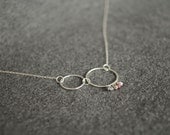 silver hoop necklace with raw diamond, ruby, pyrite, and white topaz . casino royale