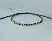 riley. petite faceted gold nuggets adjustable braided friendship bracelet
