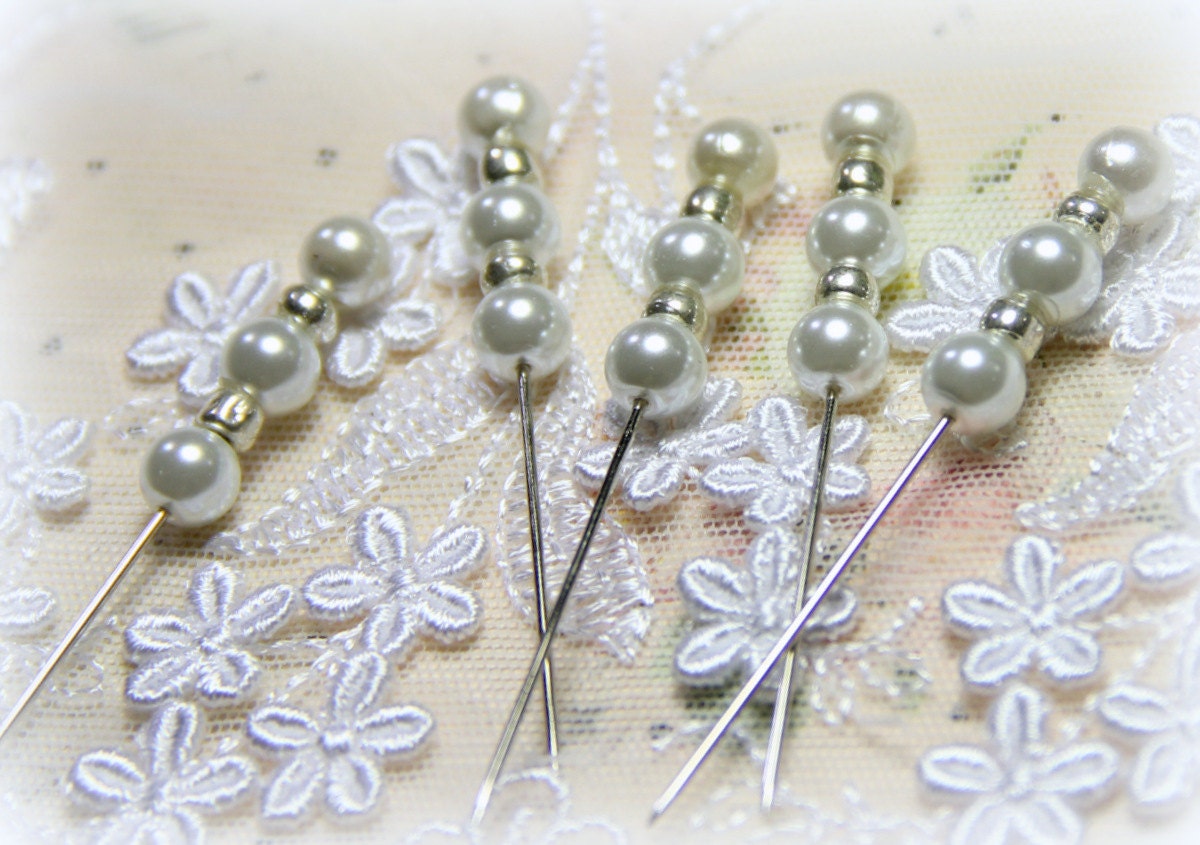 5 Pearl stick pins.