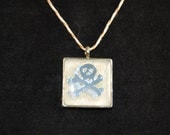 Glow Bratty Skull and Crossbones