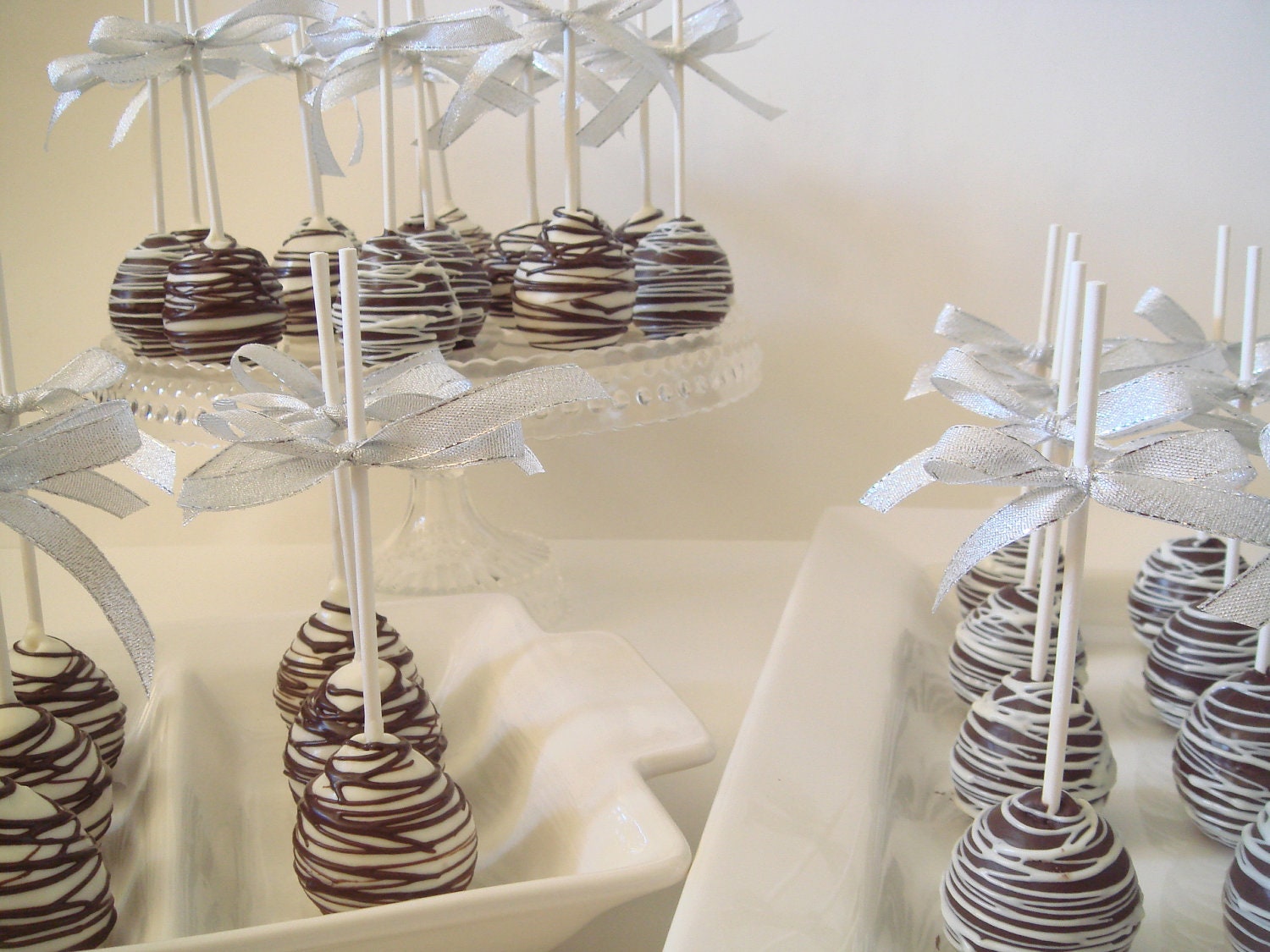 Tablescape dessert platters chocolate-covered oreos cookies cake pops candy for your party event