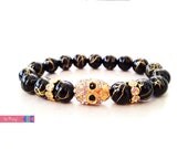 Gold Drizzled Black Bead Bracelet with Crystal Skull Charm and Rondelles