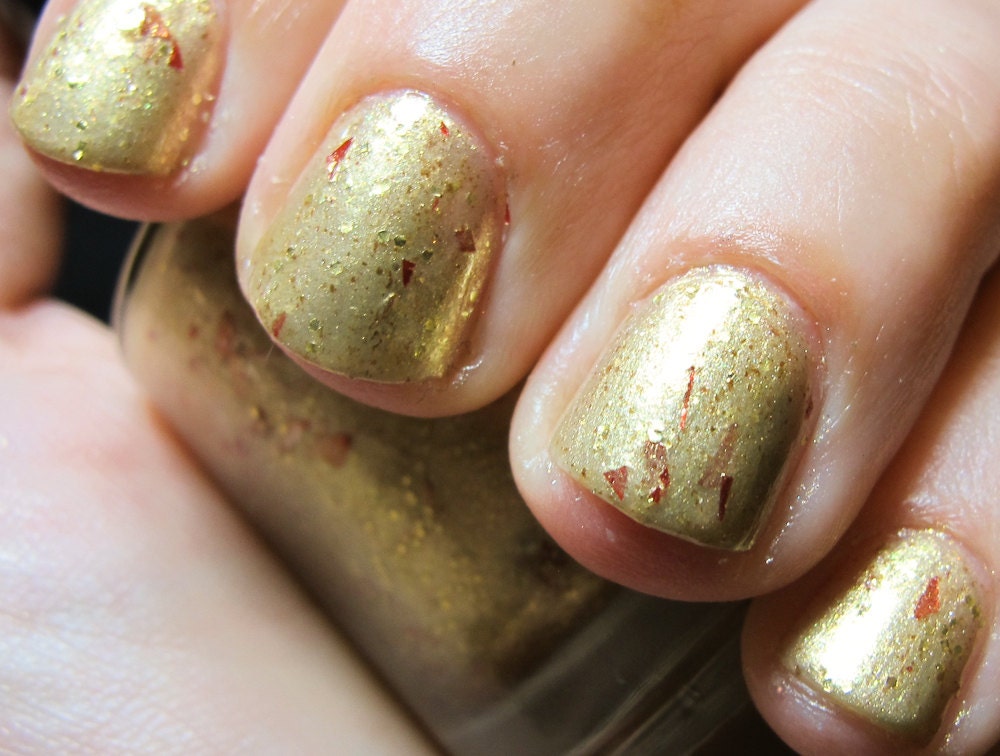 A Golden Crown Nail Polish - MINI - gold flecked foil with red shreds