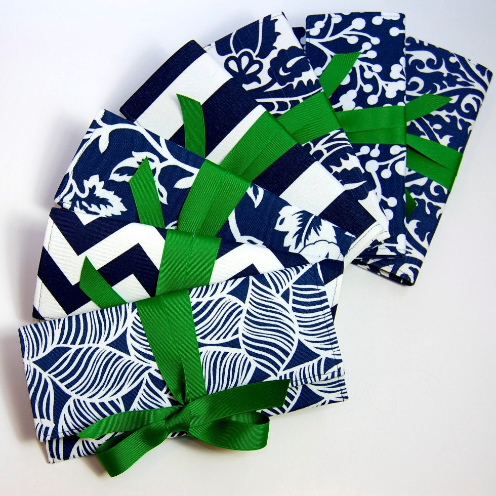 Navy blue and white bridesmaid clutches with emerald green bows.  Custom colors available.