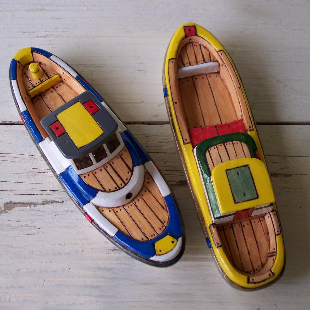 Two Yellow and Blue Toy Wooden Boats