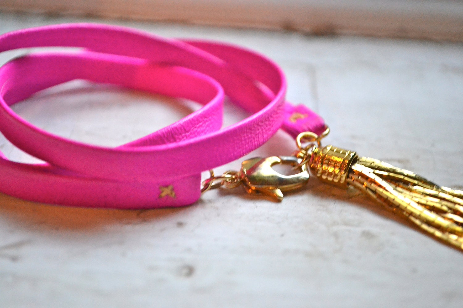 neon pink genuine leather & gold triple wrap bracelet with tassel